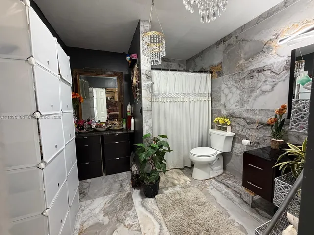 a bedroom with bed and a window