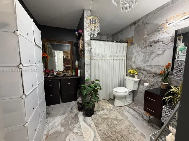 a bedroom with bed and a window