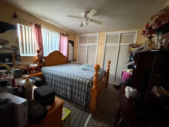 a bed room with a bed and a window