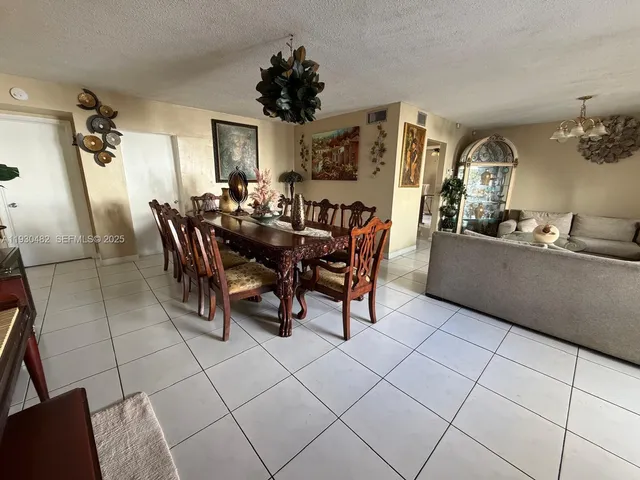 a view of a swimming pool with lounge chairs