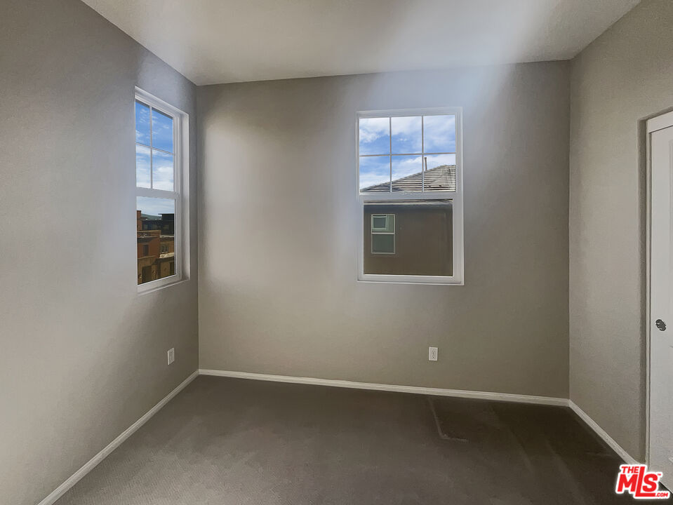 7396 Solstice Place Rancho Cucamonga, CA 91739 - Photo 14 of 18 an empty room with a window