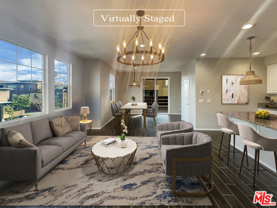 7396 Solstice Place Rancho Cucamonga, CA 91739 - Photo 2 of 18 a view of a dining room with furniture a chandelier and wooden floor