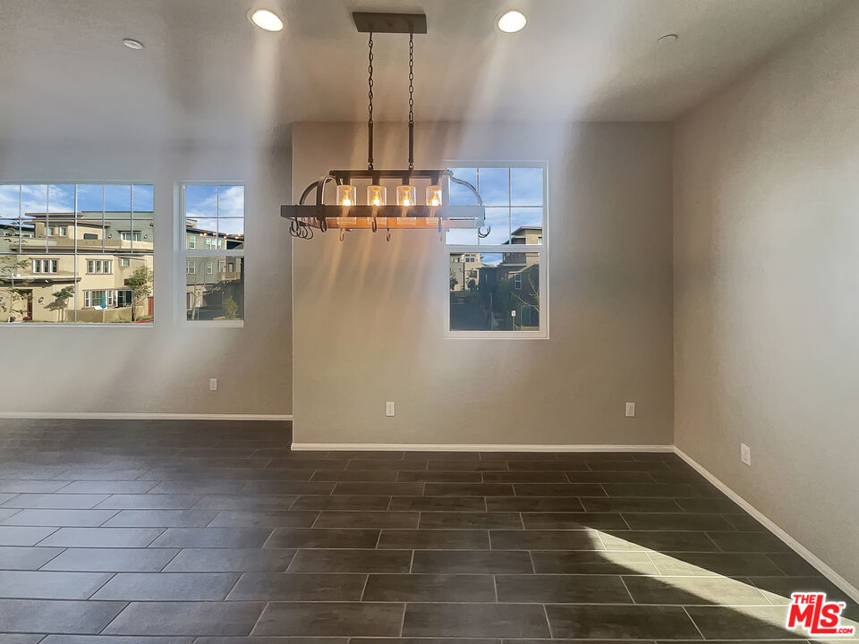 7396 Solstice Place Rancho Cucamonga, CA 91739 - Photo 9 of 18 a view of empty room with wooden floor