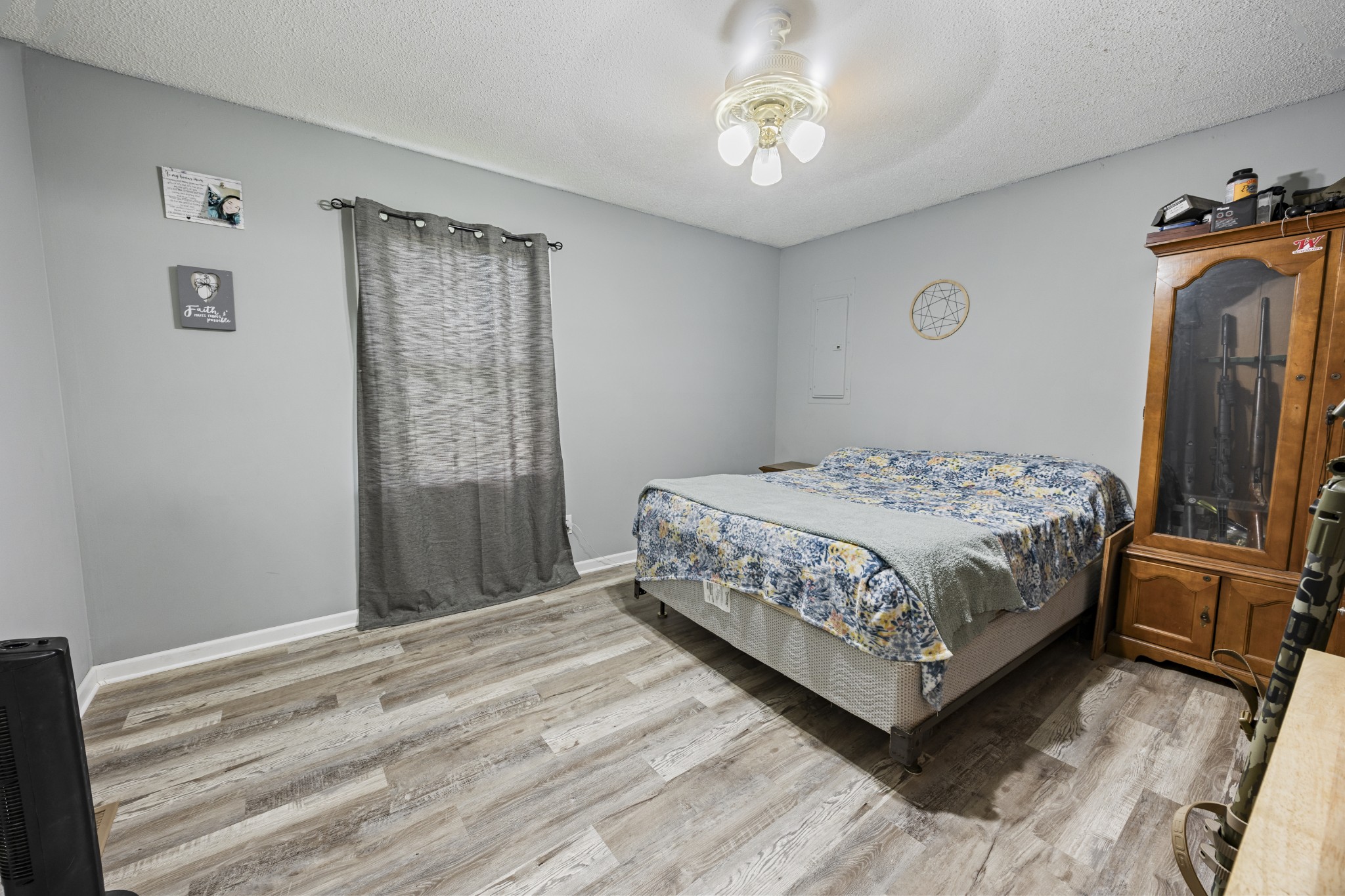 421 Shady Grove Road Flintville, TN 37335 - Photo 18 of 33 a bedroom with a bed and a flat tv screen on a dresser