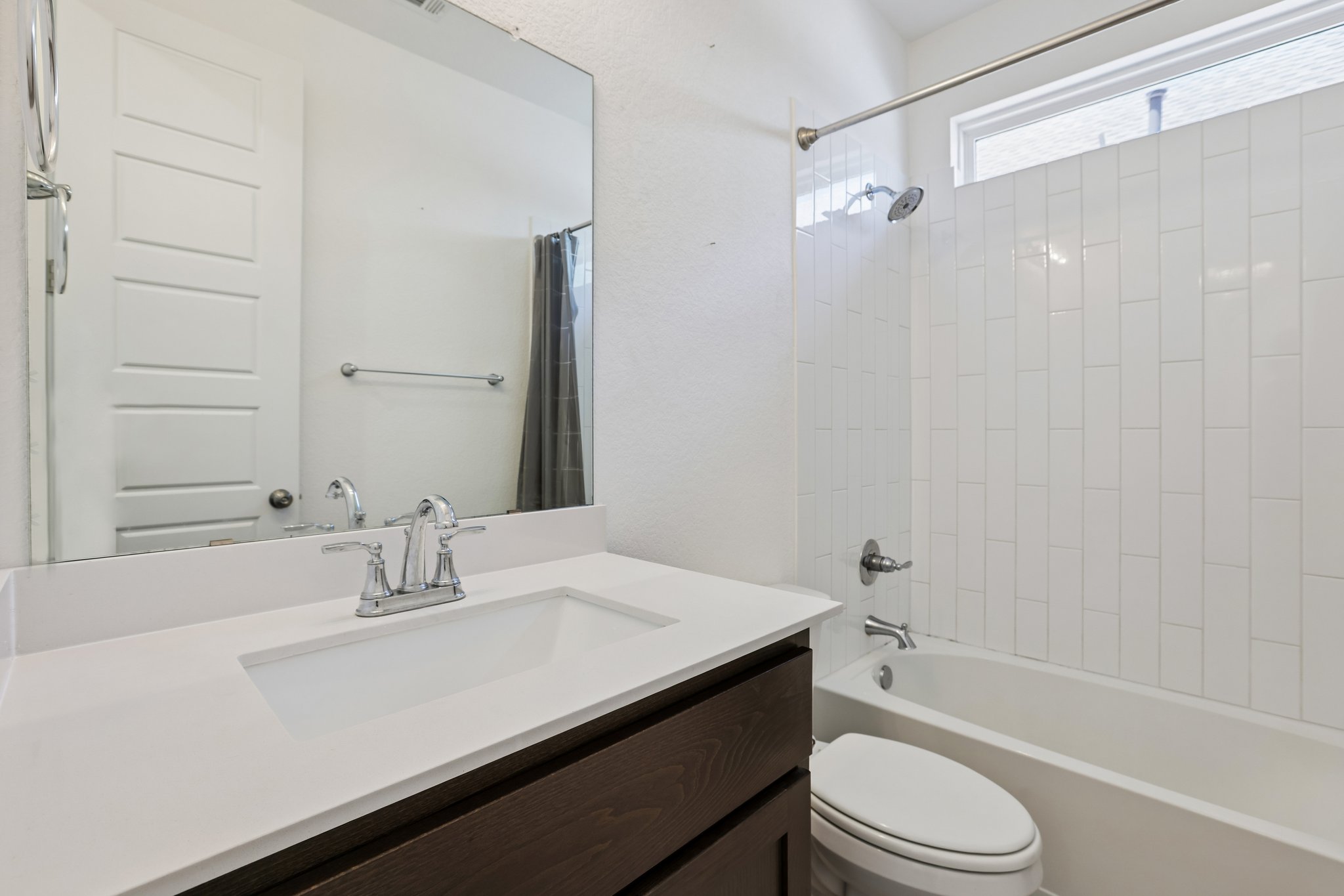 317 Independence Drive Kyle, TX 78640 - Photo 26 of 40 a bathroom with a sink a toilet and shower