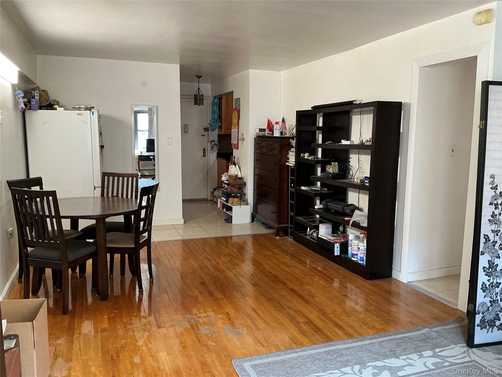 99-11 60th Avenue, Unit 3A Queens, NY 11368 - Photo 17 of 22 Dining space featuring light wood finished floors and baseboards