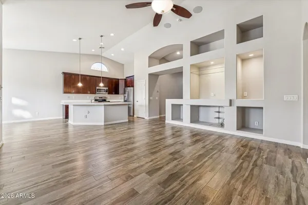 a view of kitchen and microwave with wooden floor