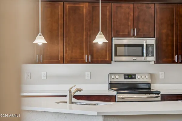 a kitchen with a cabinets and appliances