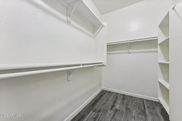 a view of an empty walk in closet