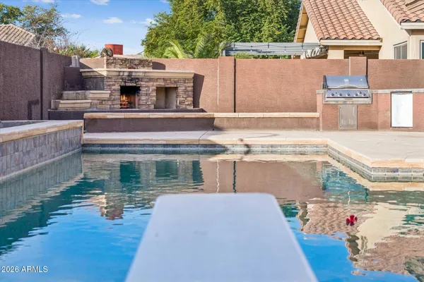 swimming pool view with a outdoor seating