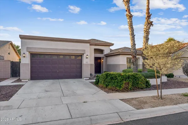 a front view of a house with garage