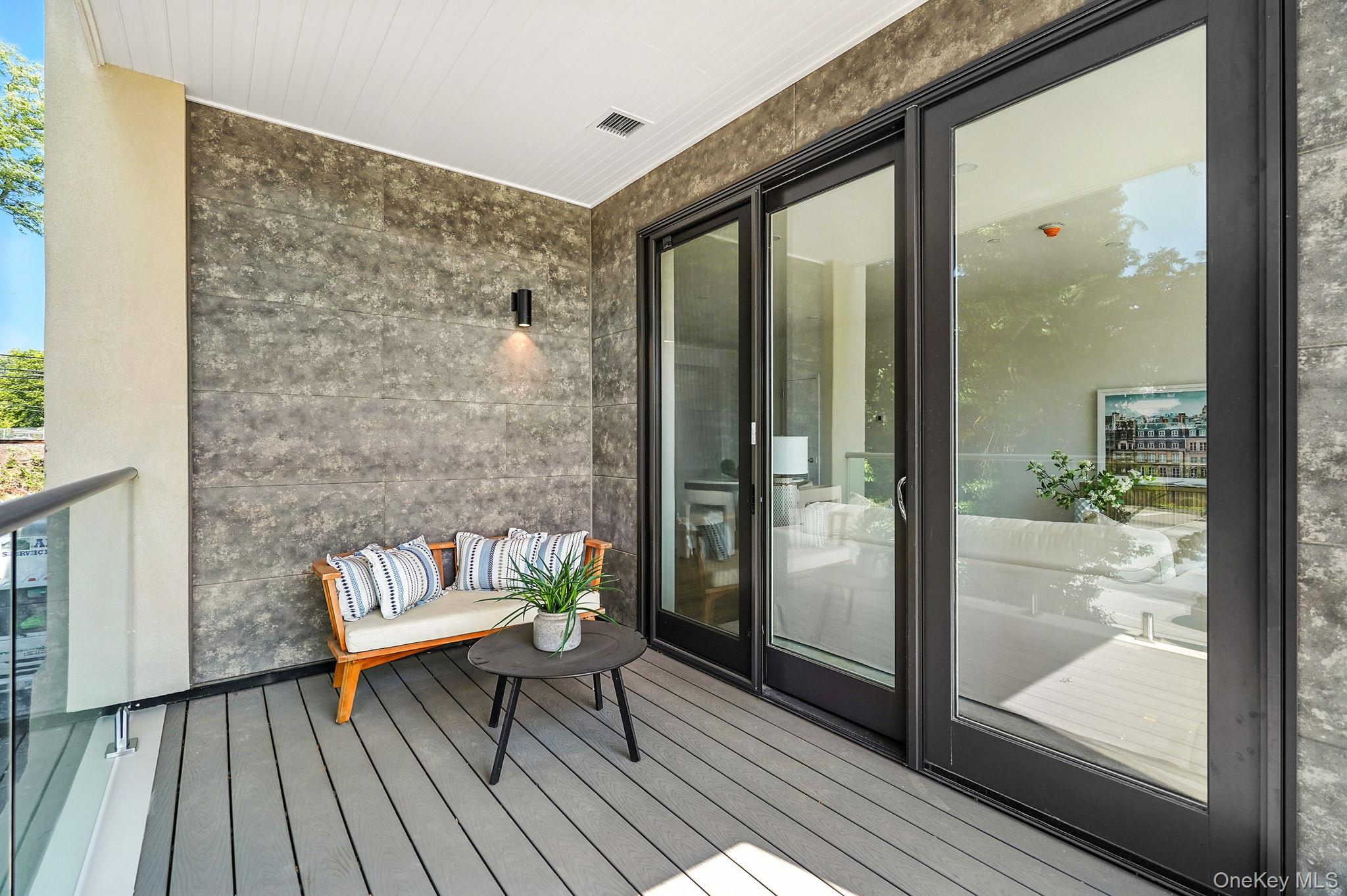 402 Halstead Avenue, Unit 205 Harrison, NY 10528 - Photo 12 of 17 a living room with furniture and wooden floor