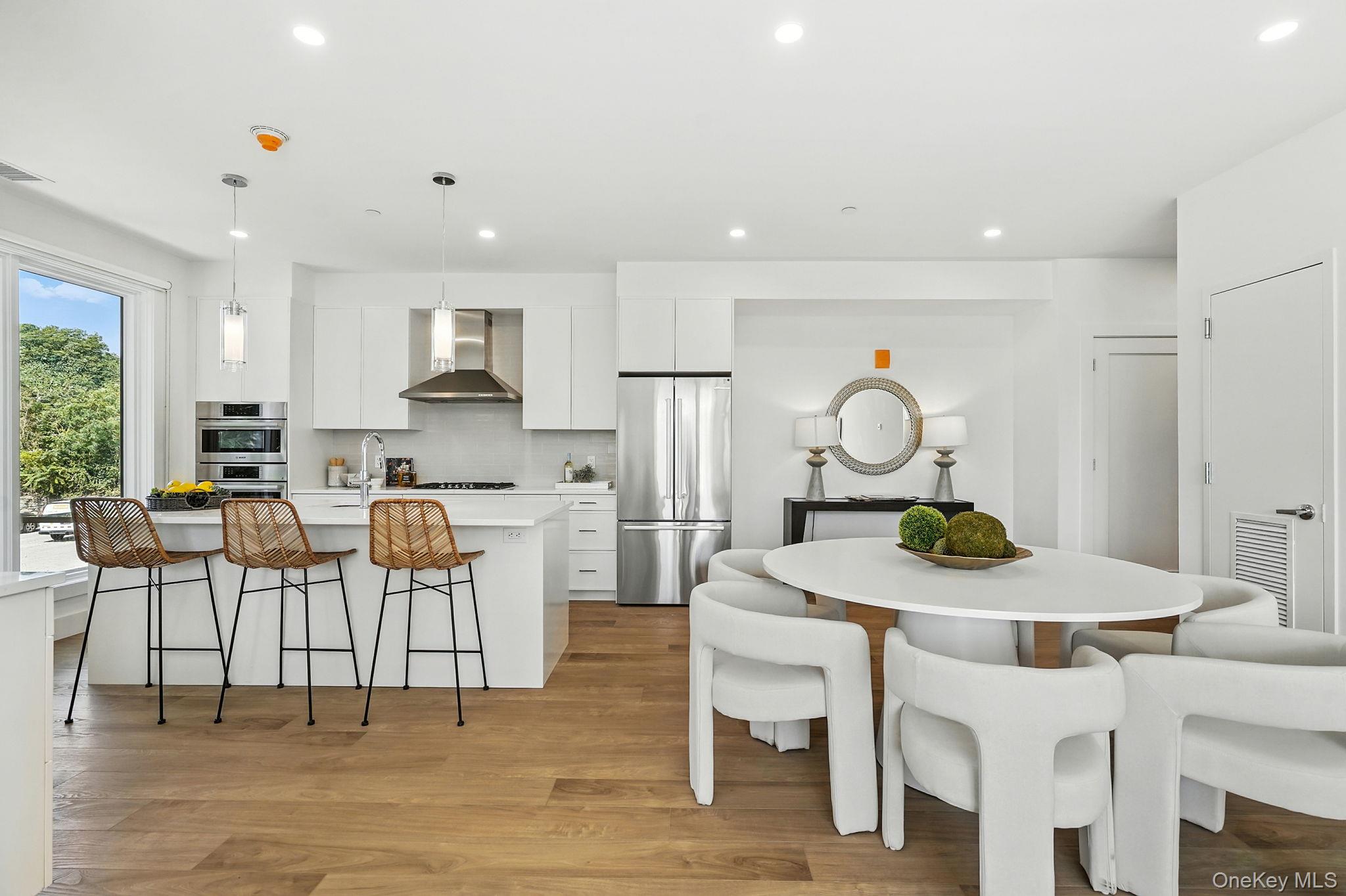 402 Halstead Avenue, Unit 205 Harrison, NY 10528 - Photo 3 of 17 a view of a dining room with furniture