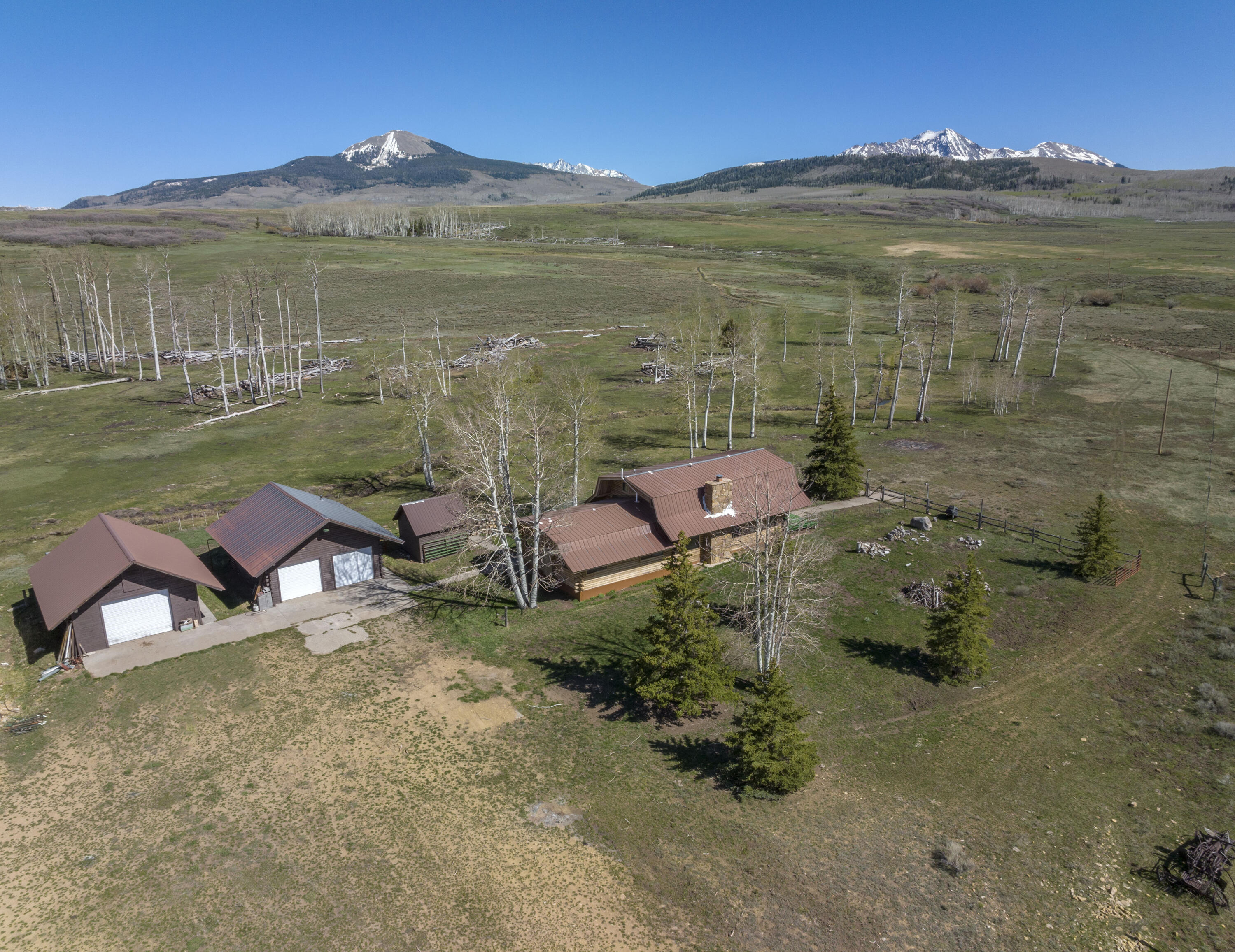 1692 County Road Placerville, CO 81430 - Photo 2 of 36 a view of a lake with a mountain in the background