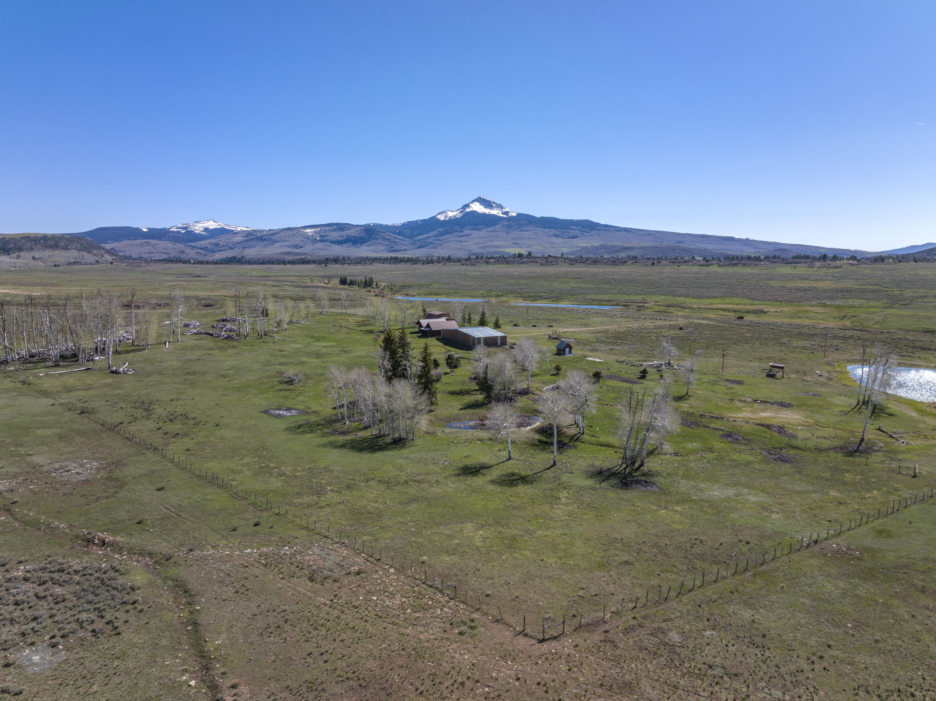 1692 County Road Placerville, CO 81430 - Photo 3 of 36 a view of a lake with a yard