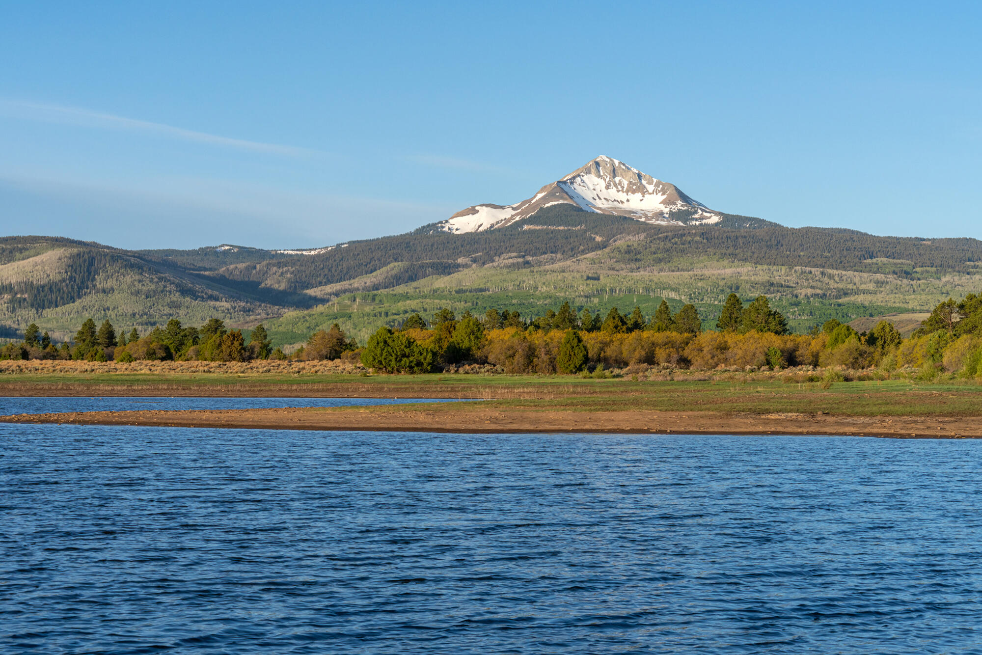 1692 County Road Placerville, CO 81430 - Photo 33 of 36 a view of a lake with mountains in the background