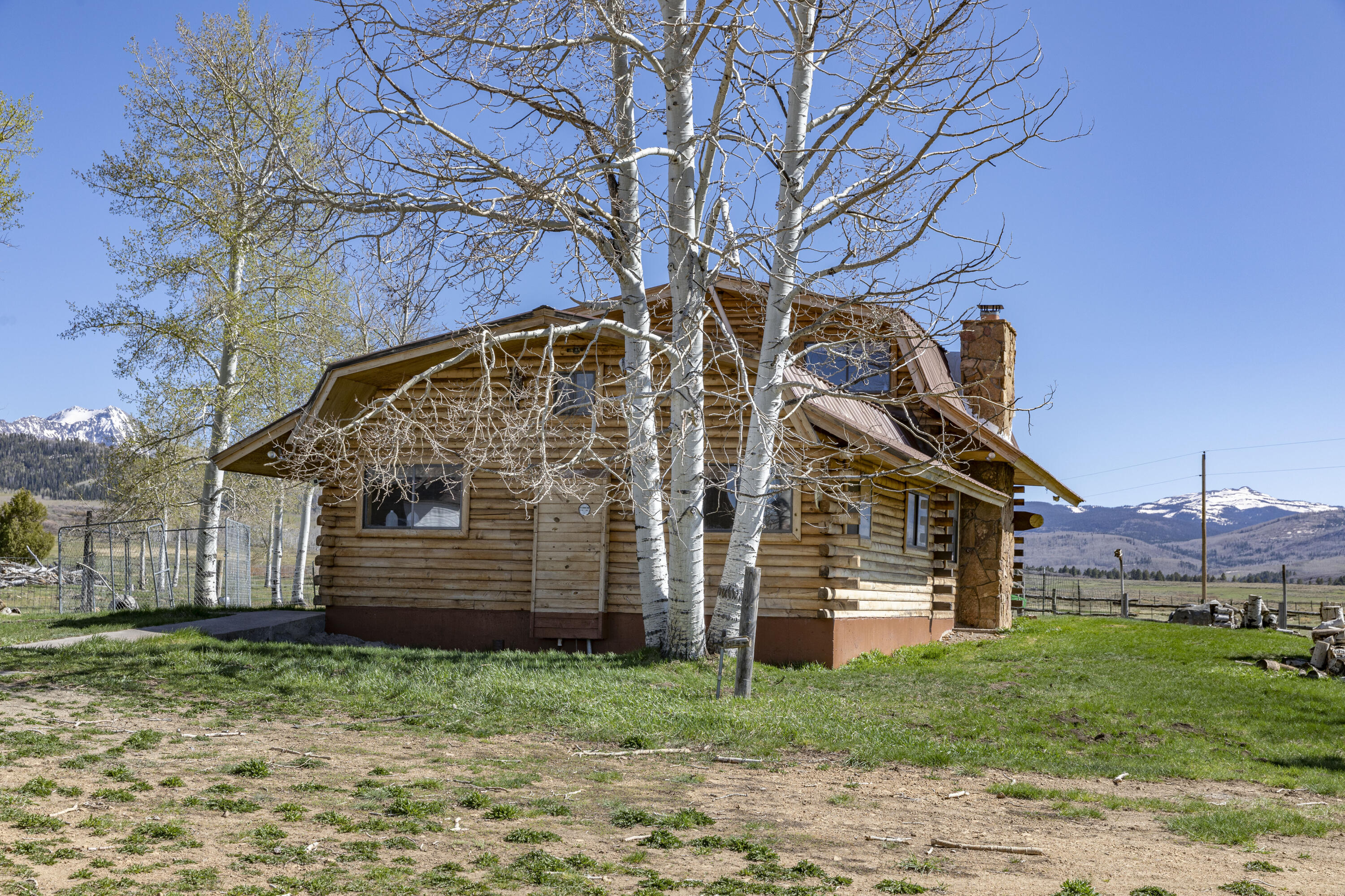1692 County Road Placerville, CO 81430 - Photo 8 of 36 a view of a house with a yard