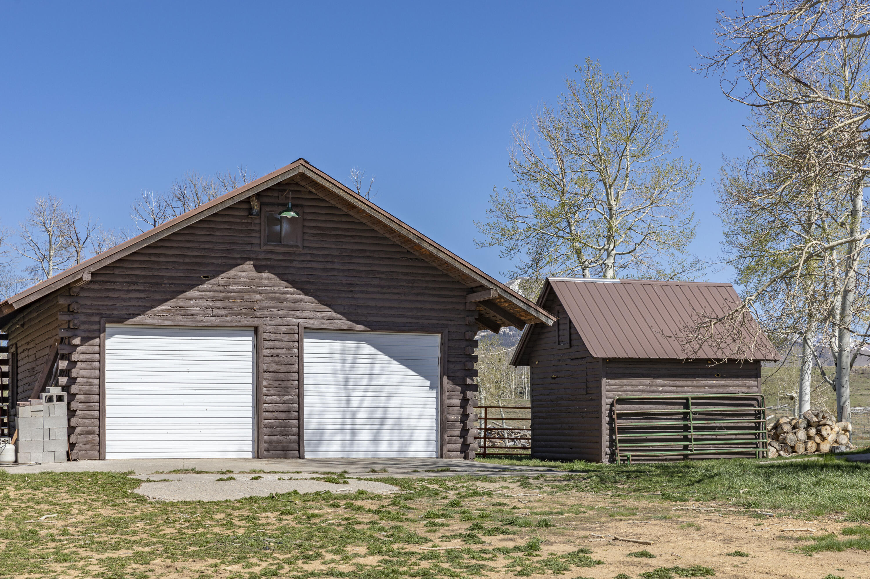 1692 County Road Placerville, CO 81430 - Photo 10 of 36 a front view of a house with a garden