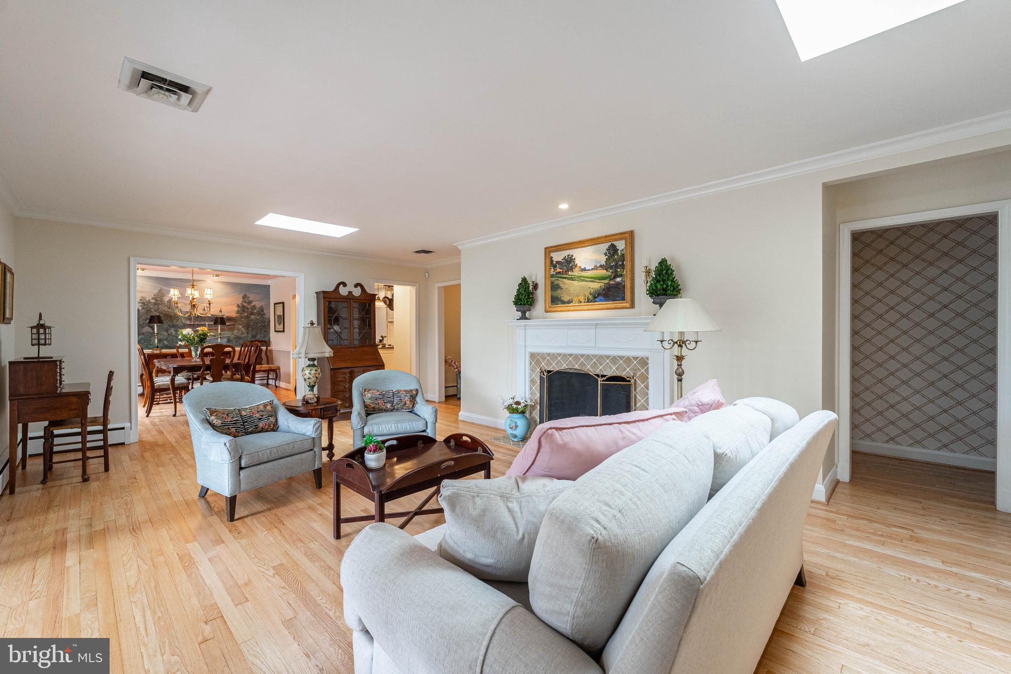 605 St Francis Road Baltimore, MD 21286 - Photo 21 of 56 a living room with furniture a fireplace and a table