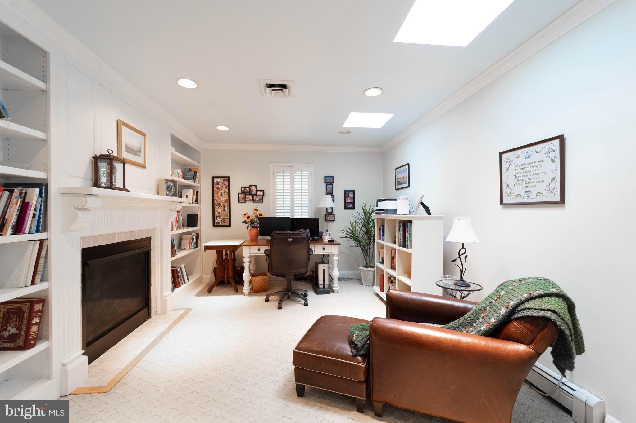 605 St Francis Road Baltimore, MD 21286 - Photo 28 of 56 a living room with furniture and a fireplace