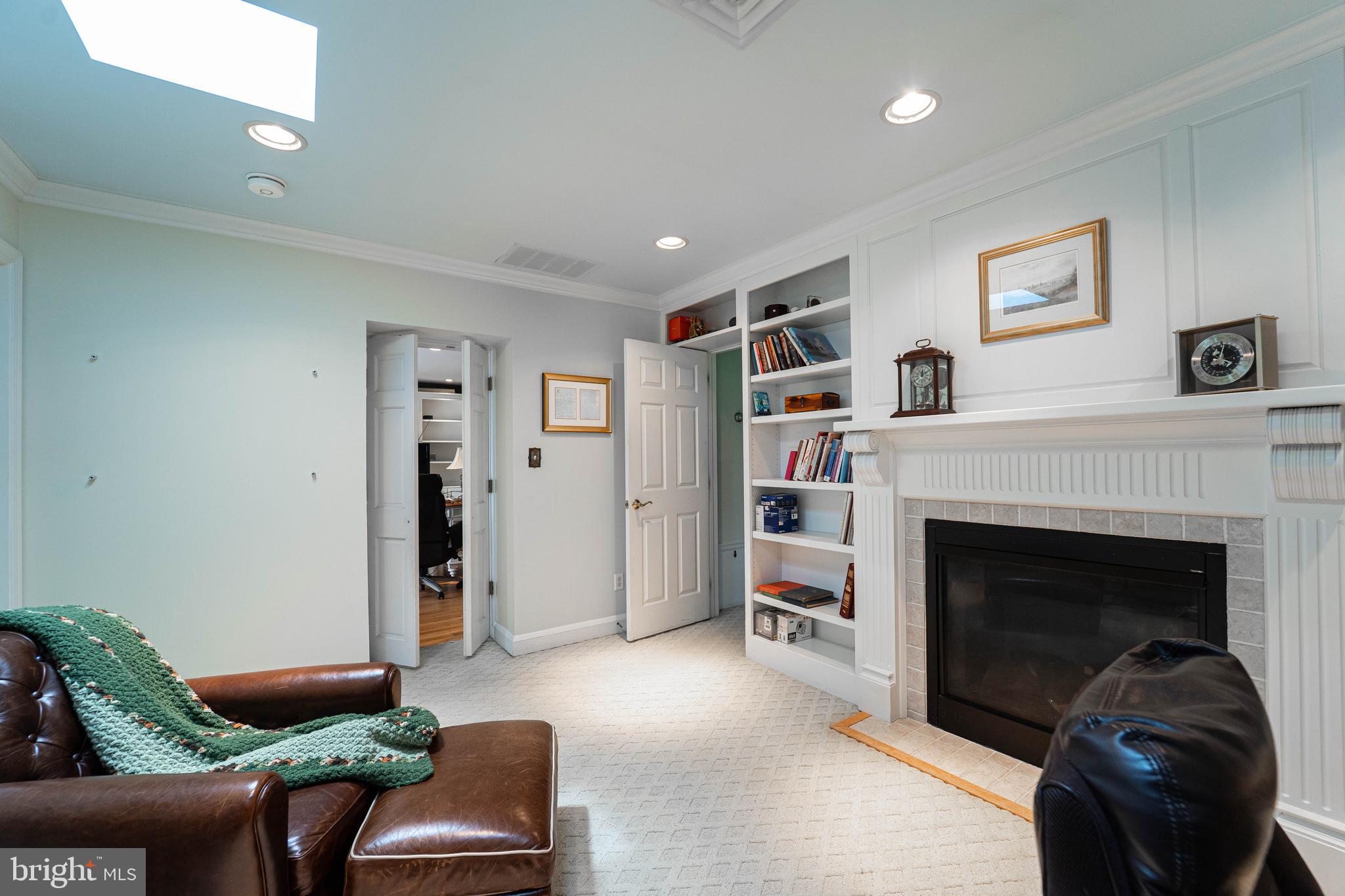 605 St Francis Road Baltimore, MD 21286 - Photo 29 of 56 a living room with furniture and a fireplace