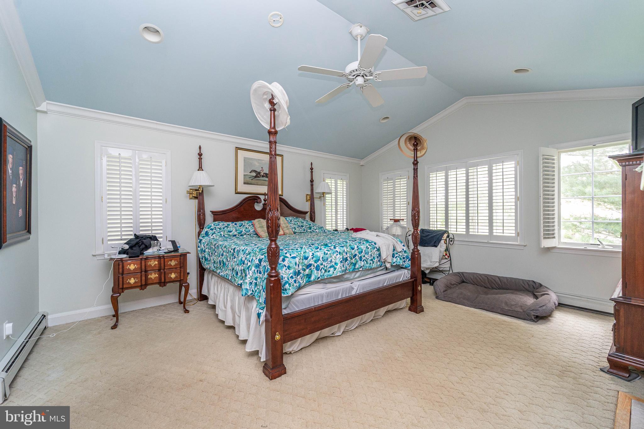 605 St Francis Road Baltimore, MD 21286 - Photo 30 of 56 a bedroom with a bed and a chandelier