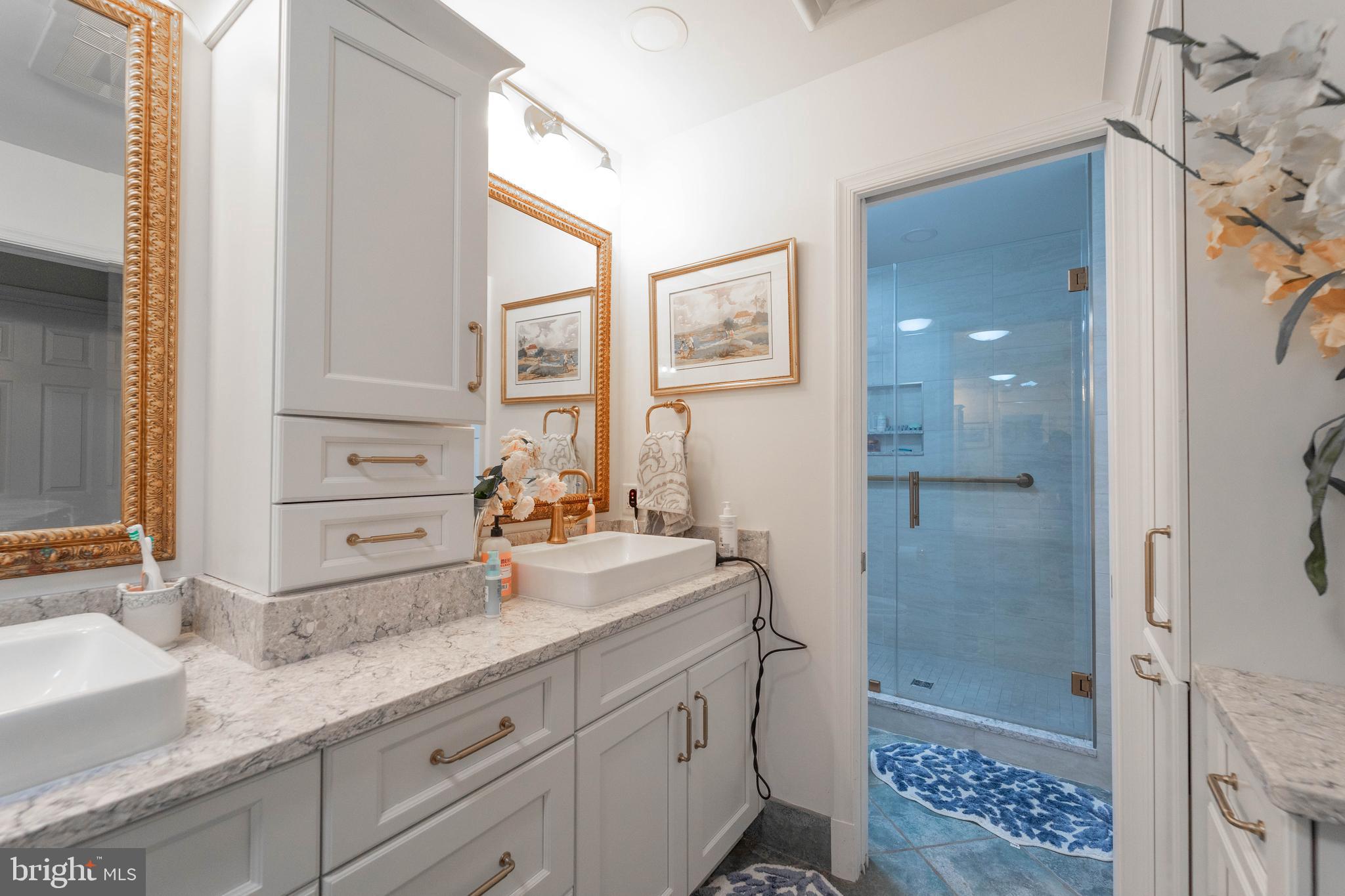 605 St Francis Road Baltimore, MD 21286 - Photo 34 of 56 a bathroom with a granite countertop sink mirror and double
