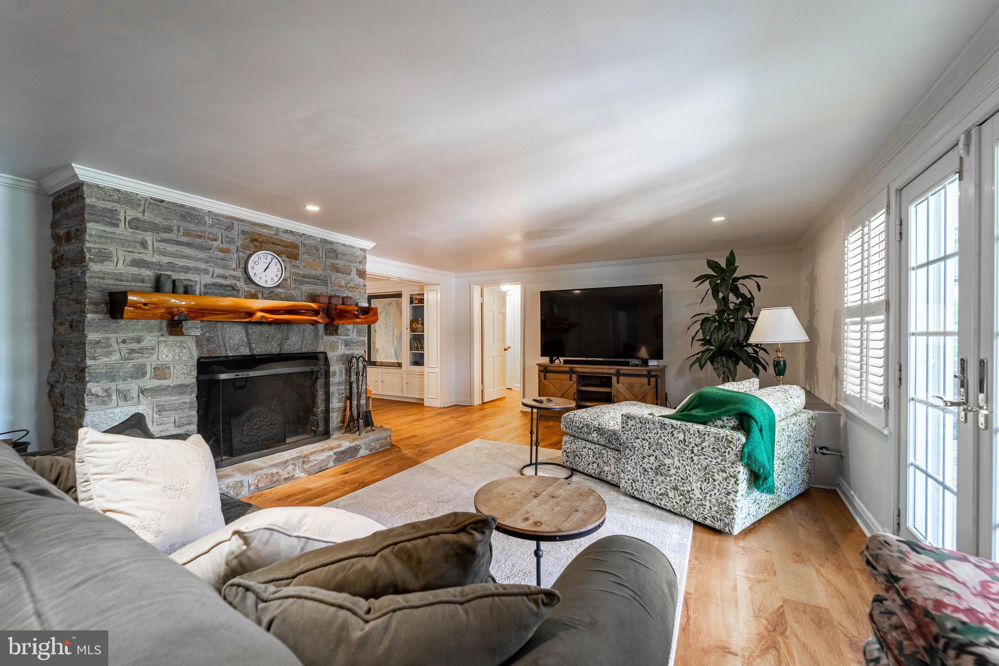 605 St Francis Road Baltimore, MD 21286 - Photo 43 of 56 a living room with furniture flat screen tv and a fireplace