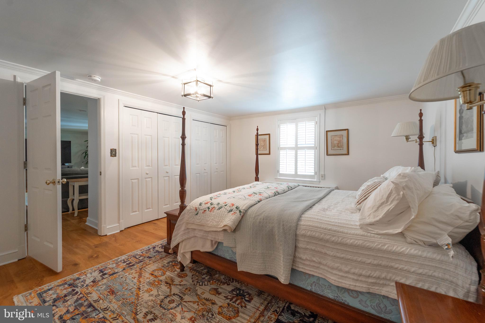 605 St Francis Road Baltimore, MD 21286 - Photo 45 of 56 a bedroom with a bed and a chandelier