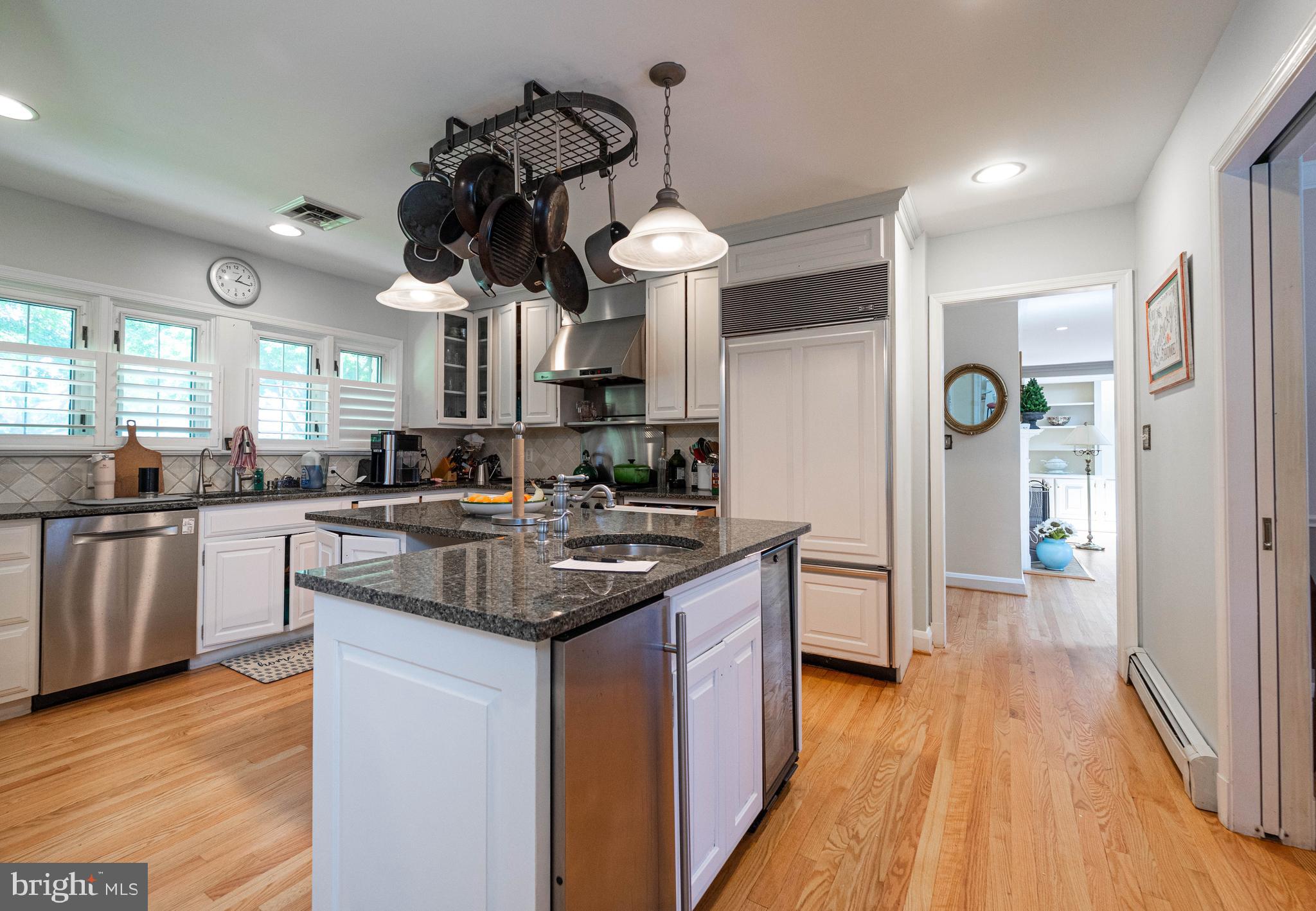 605 St Francis Road Baltimore, MD 21286 - Photo 46 of 56 a kitchen with stainless steel appliances a sink cabinets and wooden floor