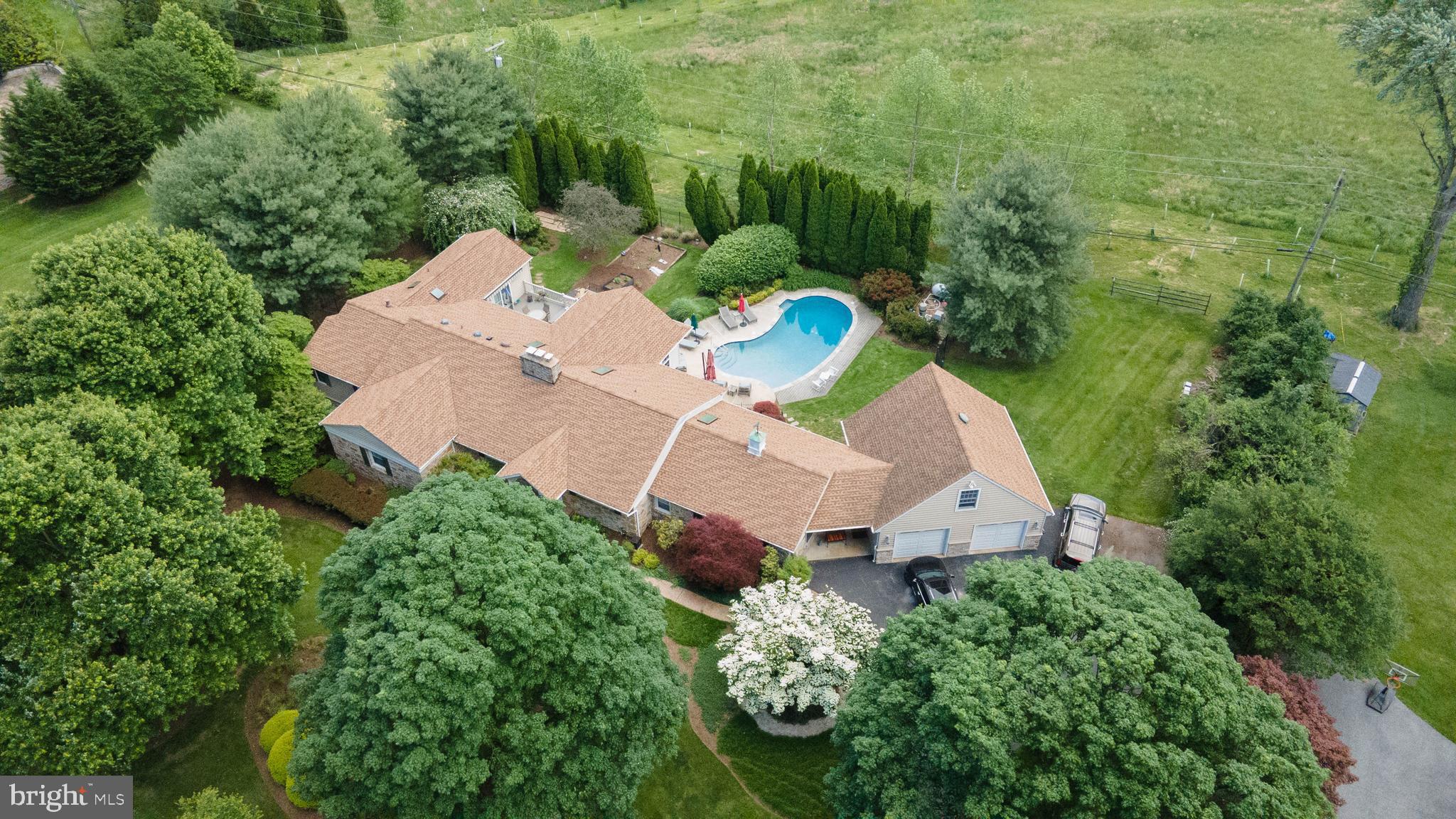 605 St Francis Road Baltimore, MD 21286 - Photo 6 of 56 an aerial view of a house with a yard and outdoor seating