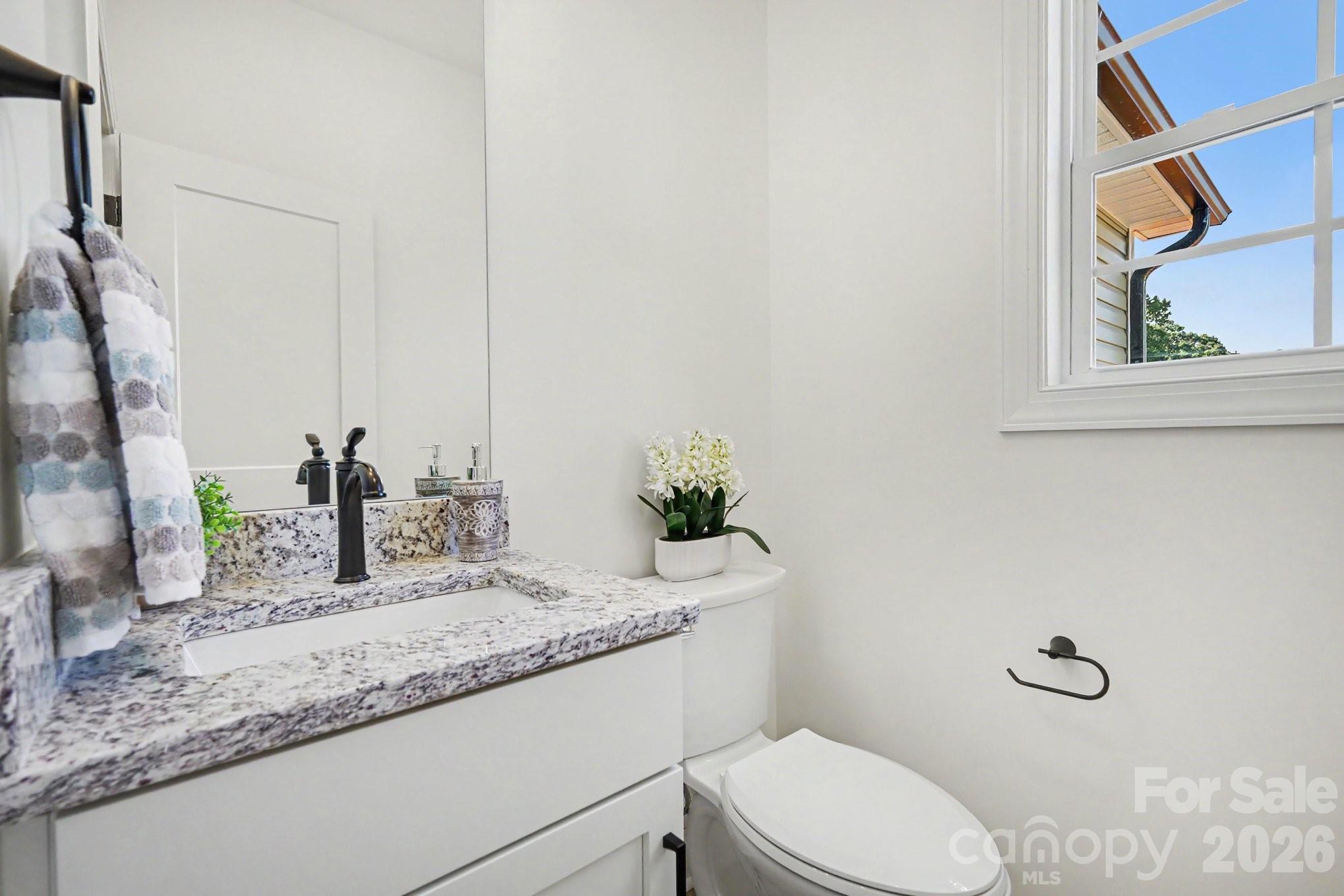 190 Goodnight Road Salisbury, NC 28147 - Photo 24 of 35 a bathroom with a granite countertop sink and a mirror