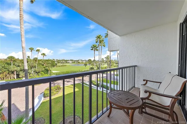 a view of a balcony with furniture