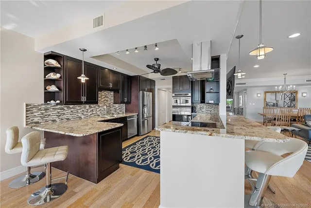 a kitchen with a table and chairs in it