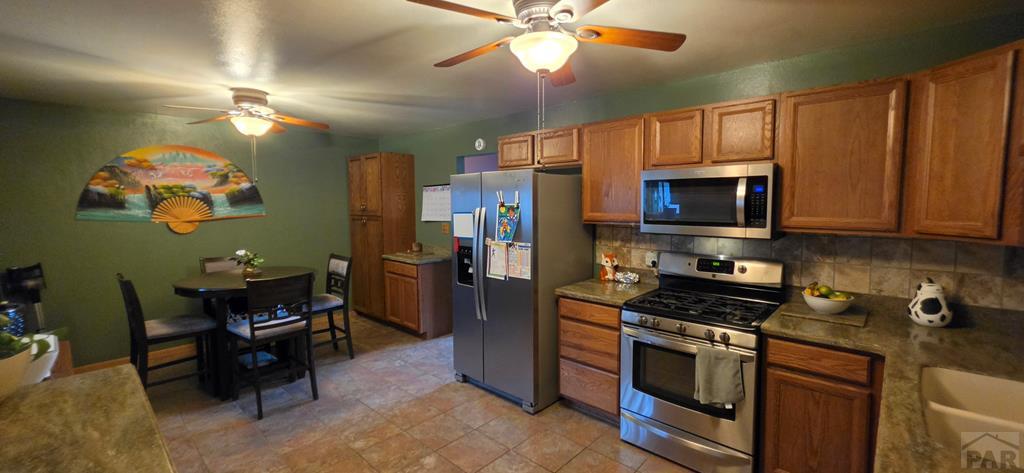 400 Oak Road Lamar, CO 81052 - Photo 13 of 23 a kitchen with a appliances and cabinets