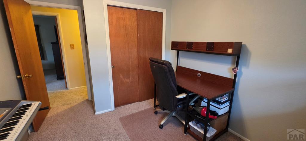 400 Oak Road Lamar, CO 81052 - Photo 14 of 23 a room with furniture and a mirror