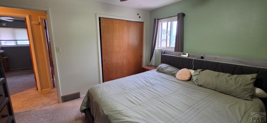 400 Oak Road Lamar, CO 81052 - Photo 17 of 23 a bedroom with a bed and a window