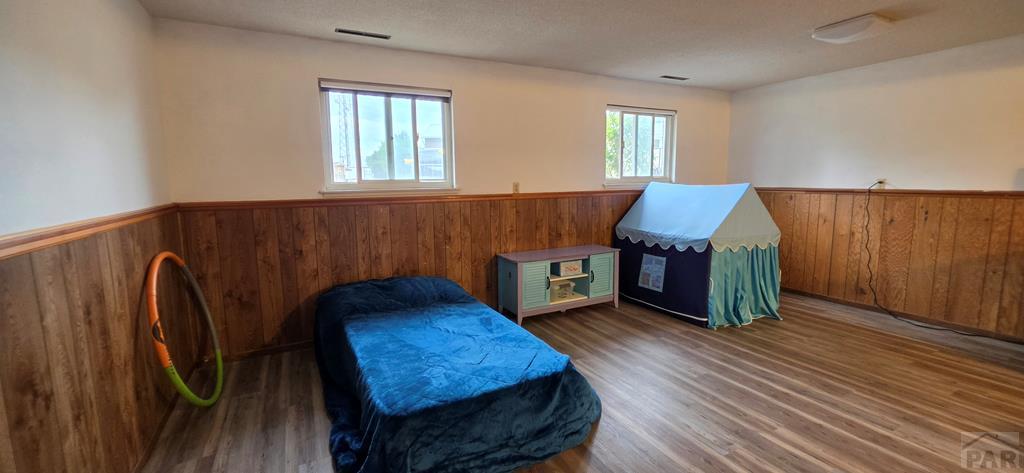400 Oak Road Lamar, CO 81052 - Photo 22 of 23 a living room with furniture and a wooden floor