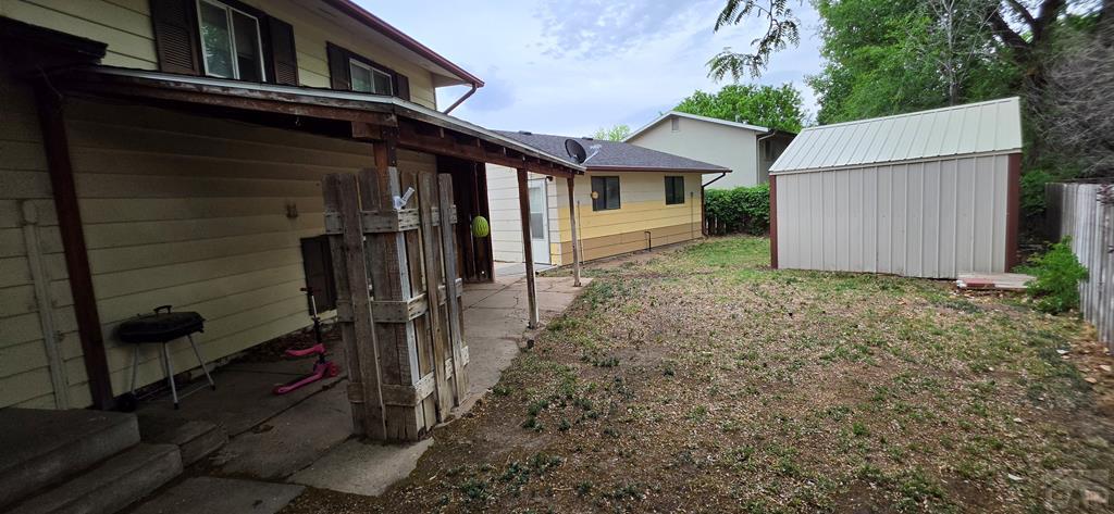 400 Oak Road Lamar, CO 81052 - Photo 4 of 23 a view of a house with a yard and large tree