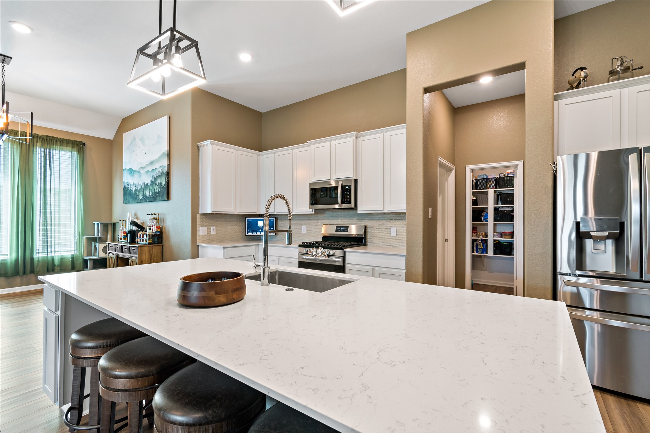 4403 Annandale Lane Rosharon, TX 77583 - Photo 18 of 48 a kitchen with sink a refrigerator and chairs