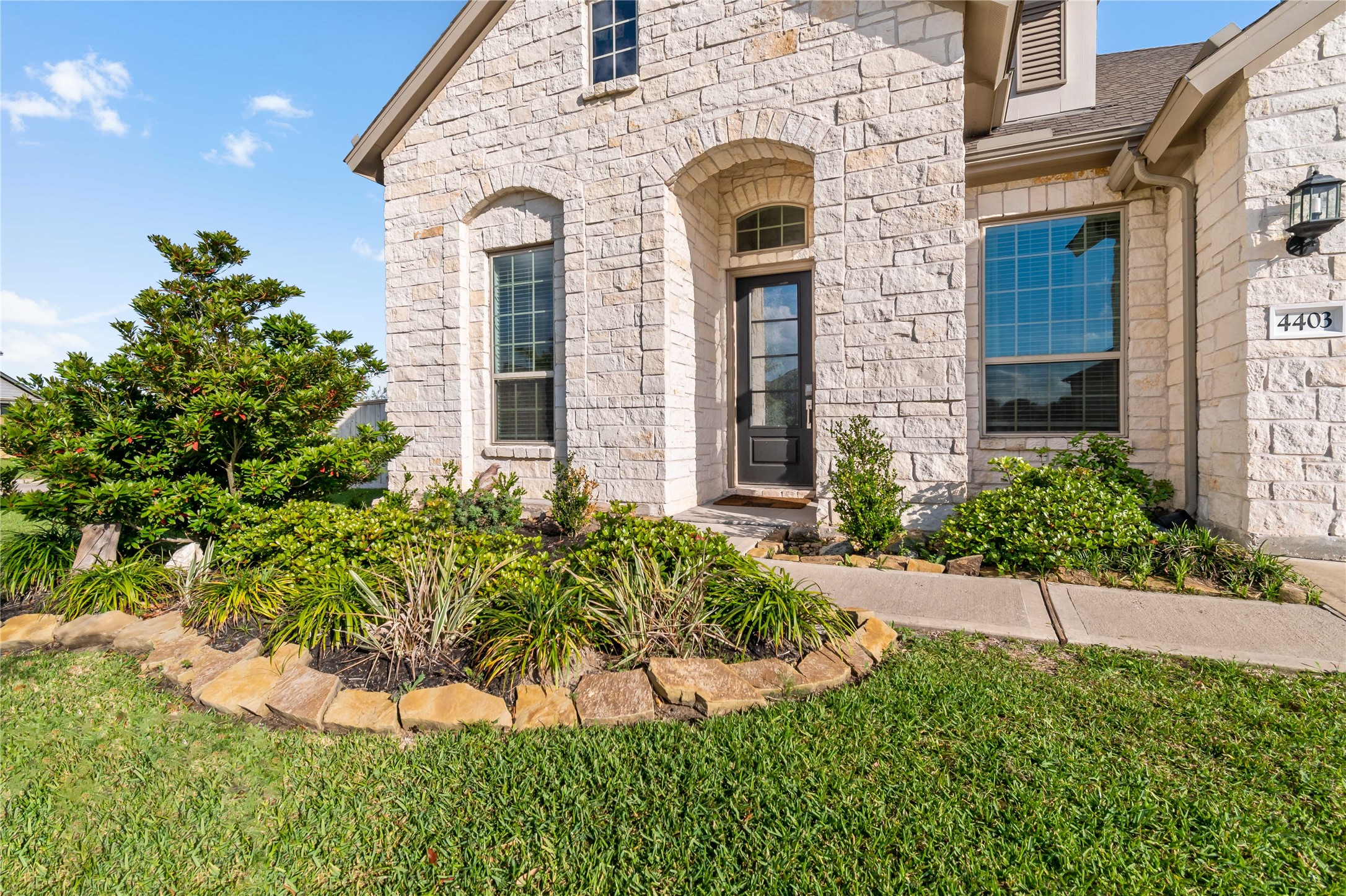 4403 Annandale Lane Rosharon, TX 77583 - Photo 2 of 48 a front view of a house with a garden