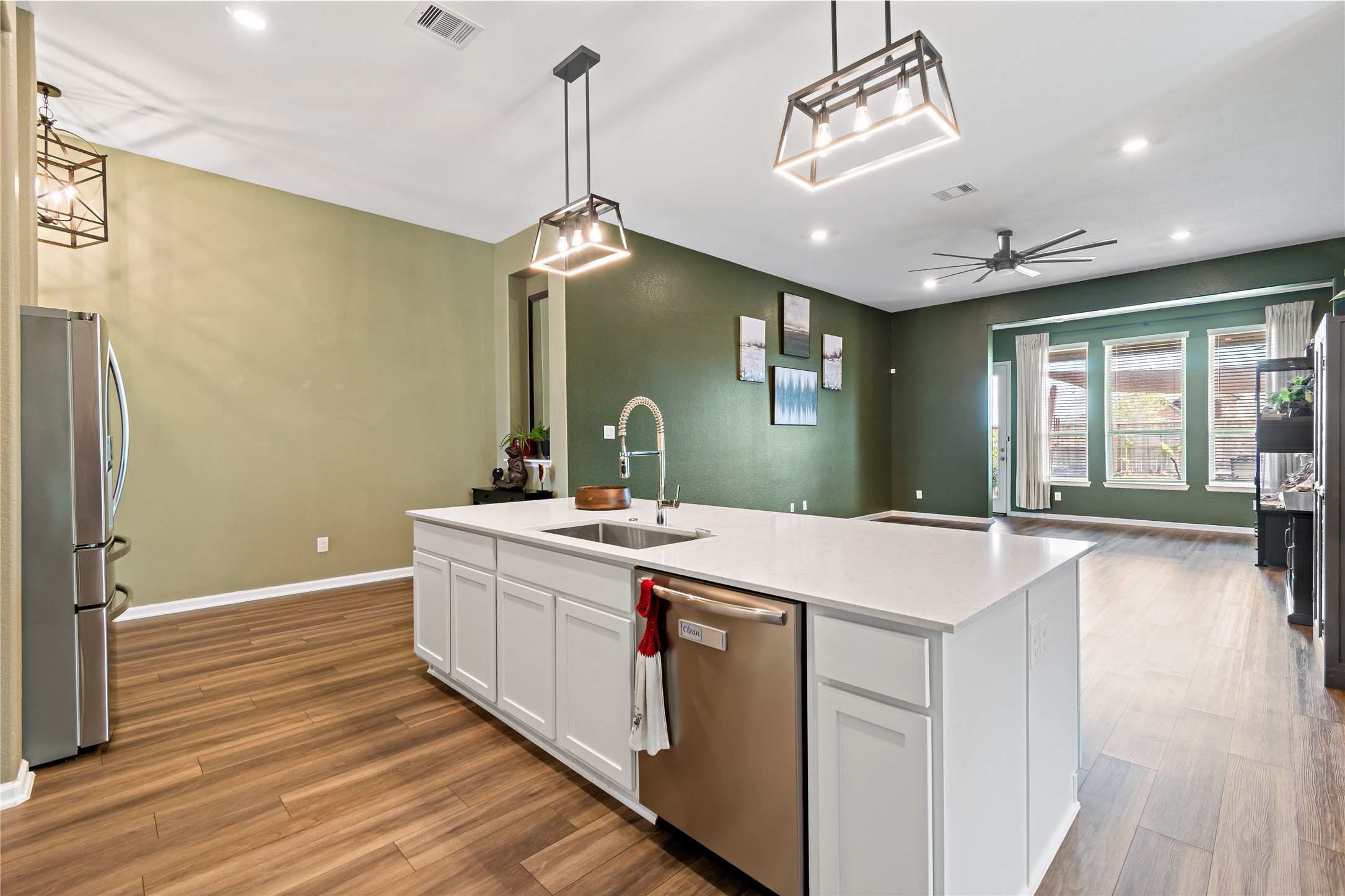 4403 Annandale Lane Rosharon, TX 77583 - Photo 21 of 48 a kitchen with kitchen island a sink and a chandelier