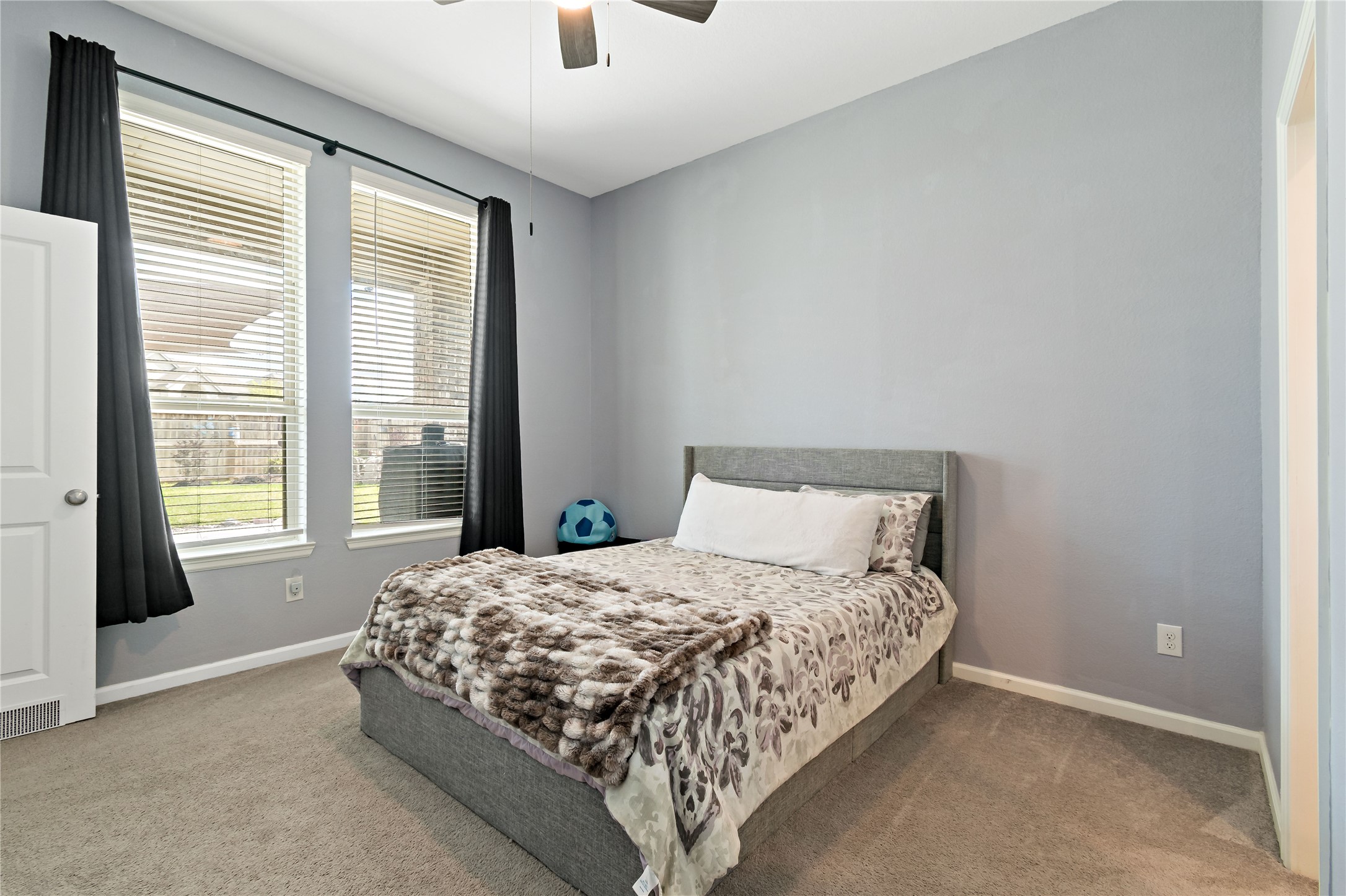 4403 Annandale Lane Rosharon, TX 77583 - Photo 32 of 48 a large bed sitting in a bedroom next to a window