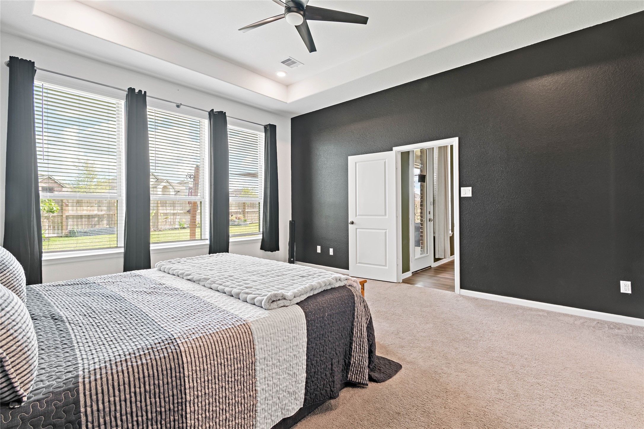 4403 Annandale Lane Rosharon, TX 77583 - Photo 34 of 48 a spacious bedroom with a large bed and a chandelier