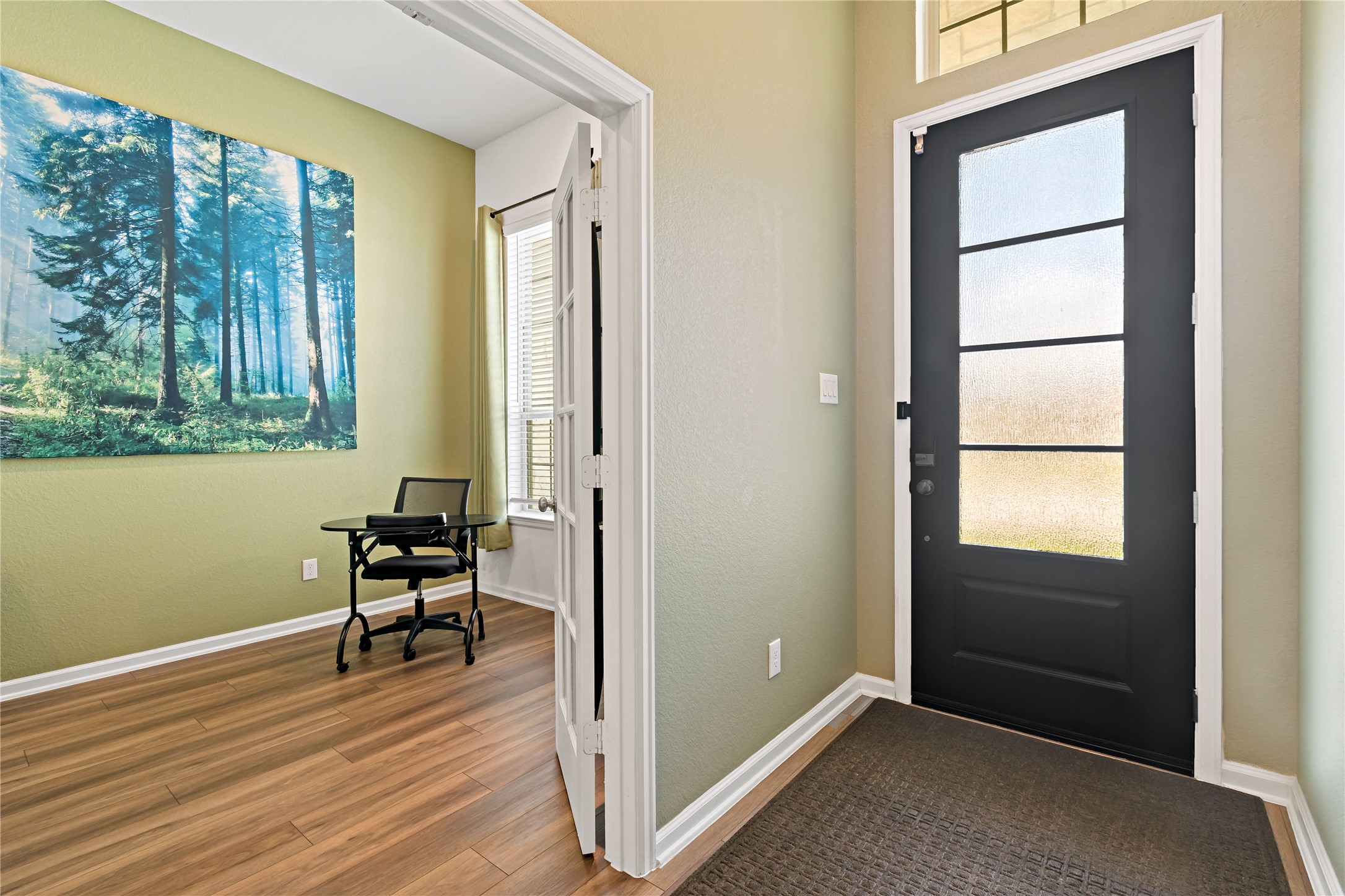 4403 Annandale Lane Rosharon, TX 77583 - Photo 4 of 48 a view of an empty room with a window and wooden floor
