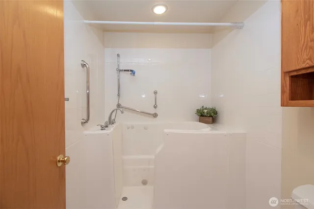 a bathroom with a bathtub and a sink