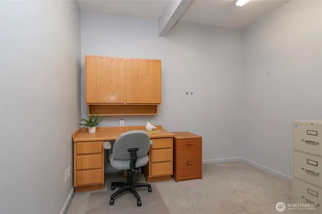 a view of a workspace with furniture