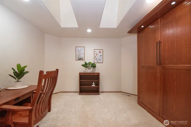a workspace with furniture and a potted plant