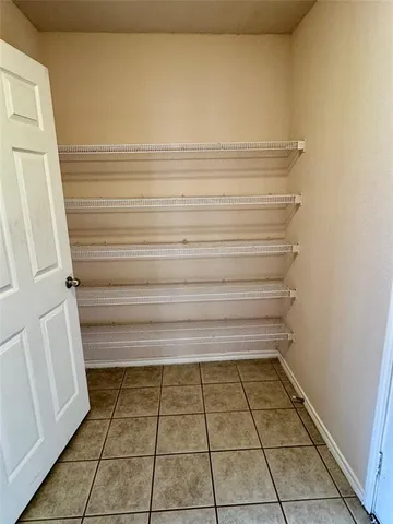 a bathroom with a vanity and a shower