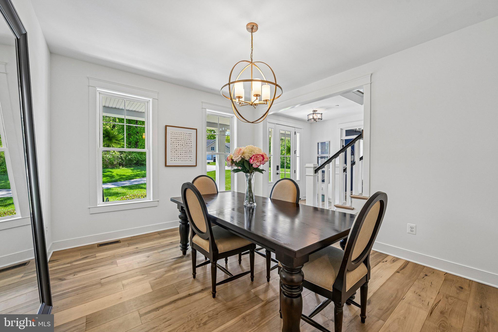 14516 Old Frederick Road Cooksville, MD 21723 - Photo 12 of 100 a view of a dining room with furniture window and wooden floor